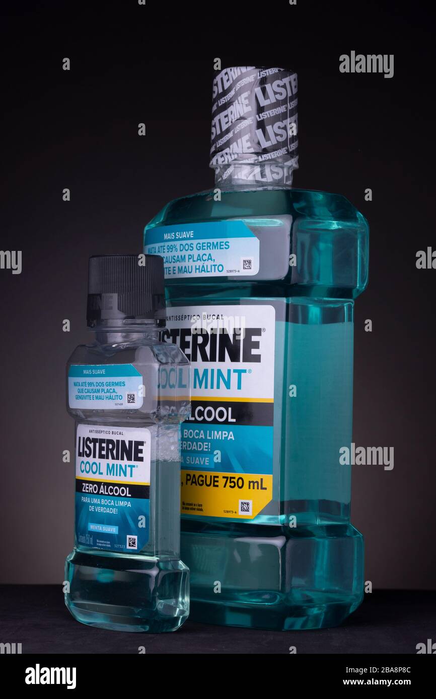Small bottle of Listerine mouthwash next to a large unopened container