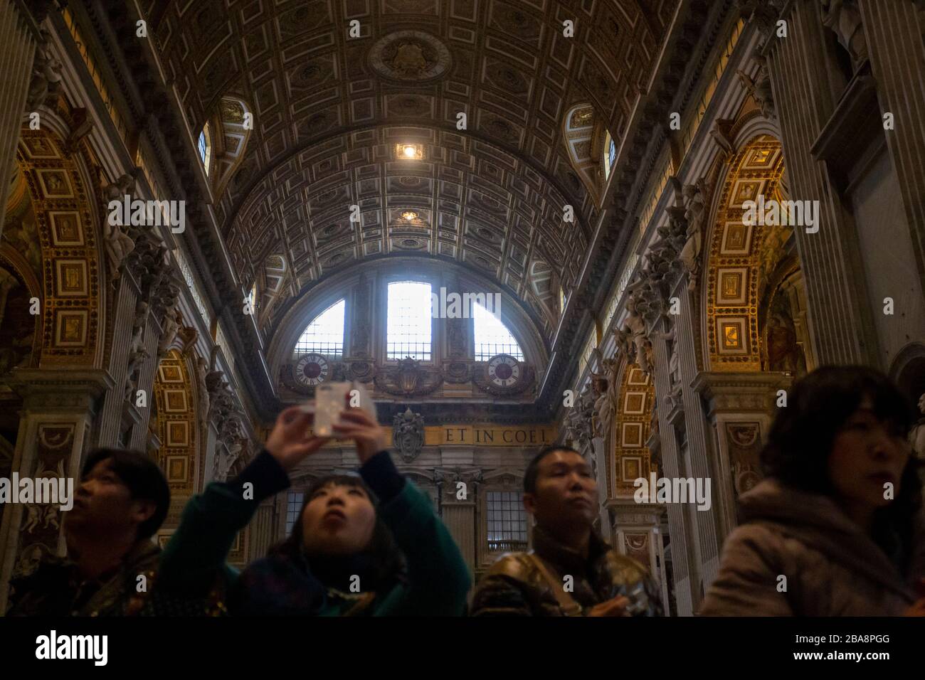 Tourists photographing inside the St Peter's Basilica in the Vatican Stock Photo
