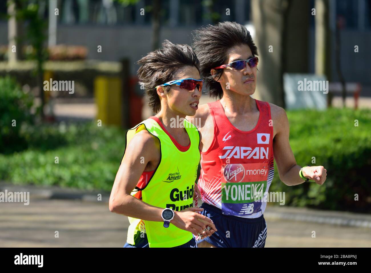 Japanese partially sighted runner, World Para Athletics, 2018 Virgin Money London Marathon, London, United Kingdom Stock Photo