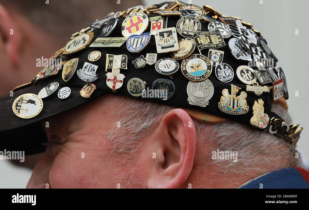 A general view of a Newcastle United supporter arriving at St. Mary's Stadium with badge pins on his hat Stock Photo