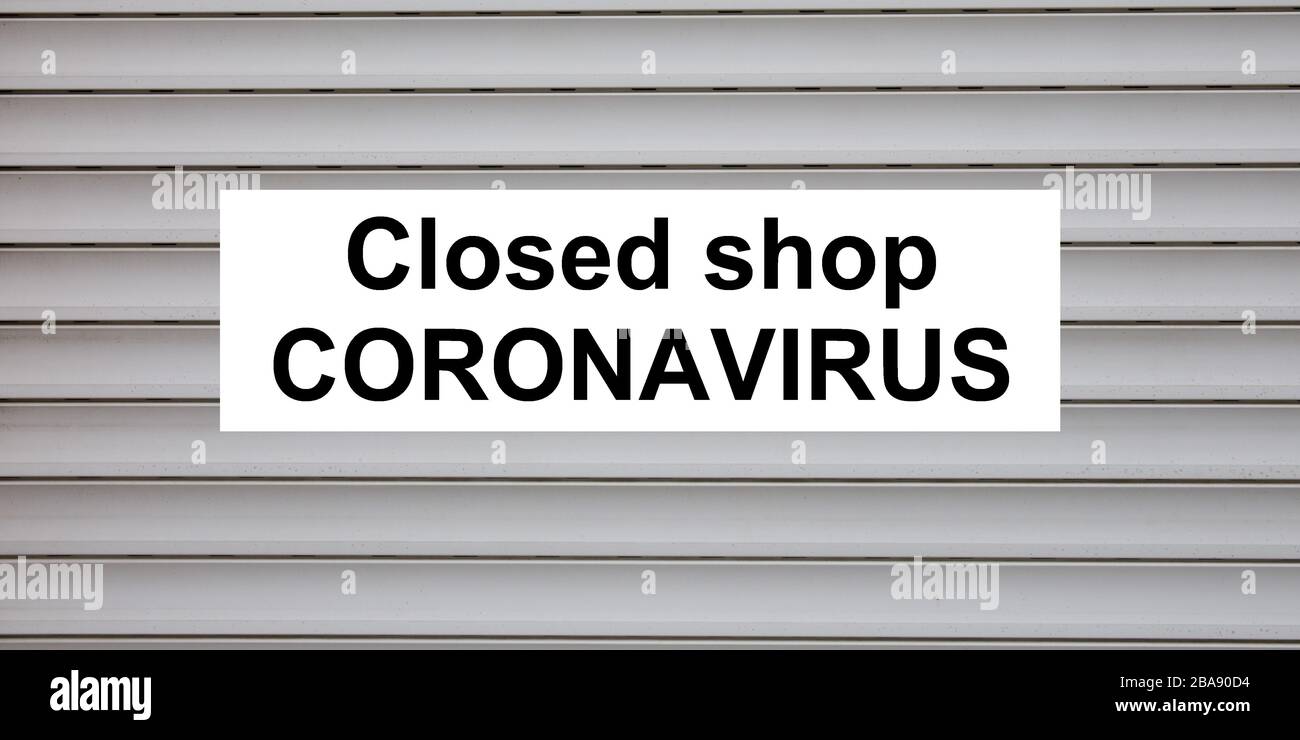 gate store closing on a shop window due to the coronavirus covid-19 Stock Photo