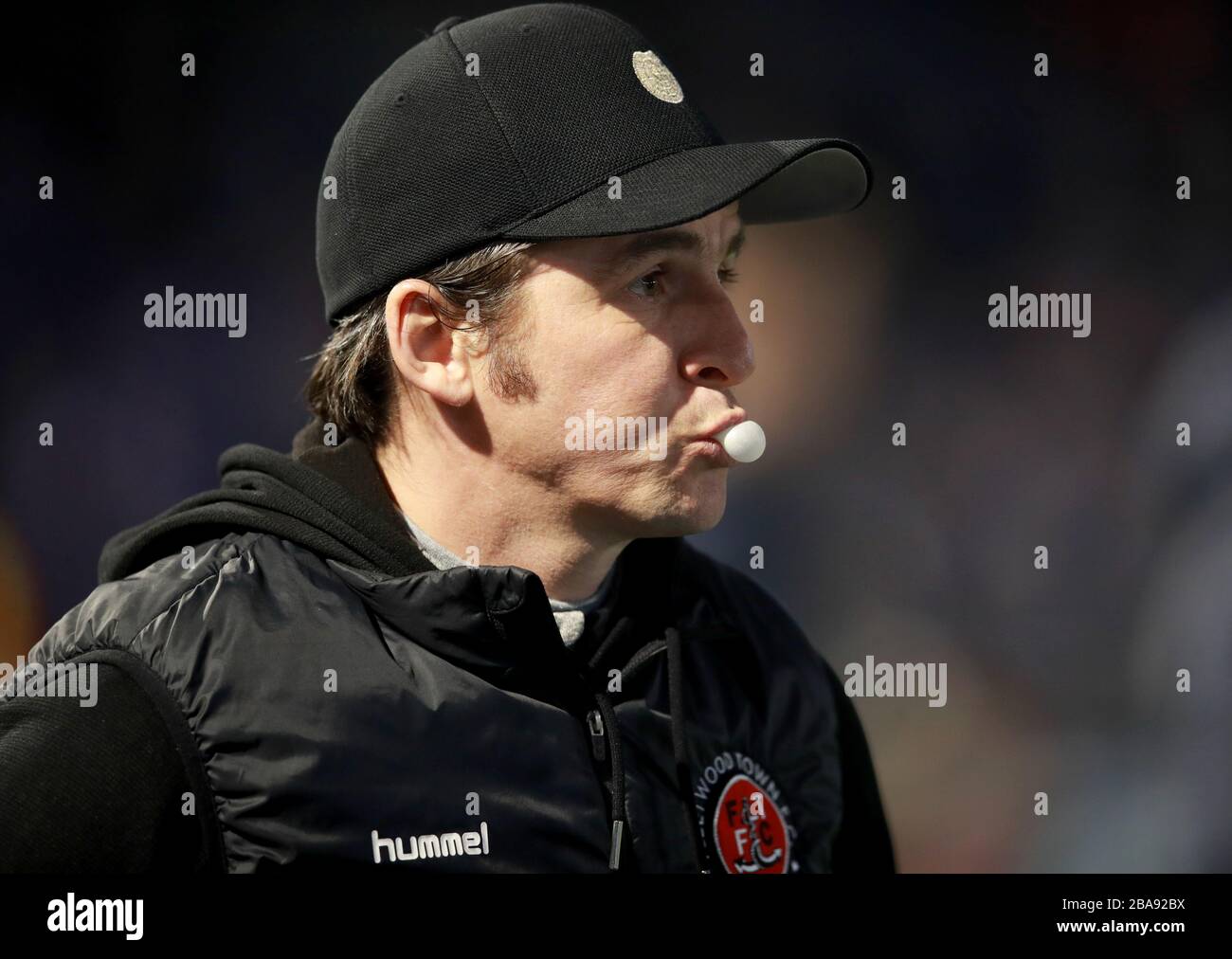 Fleetwood Town's Manager Joey Barton chews gum before the game Stock Photo