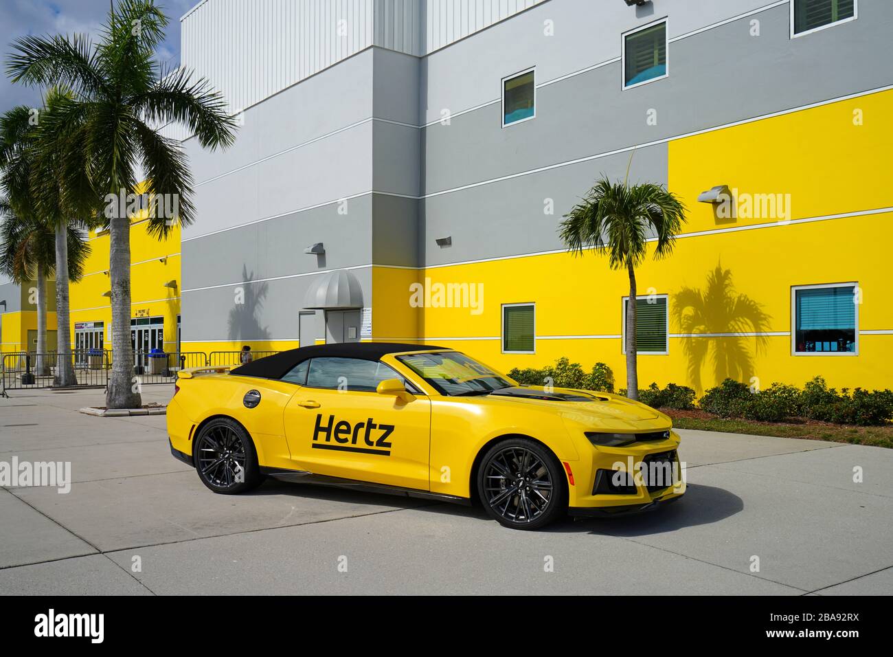 ESTERO, FL 30 JAN 2020 View of a yellow Hertz rental car in front of