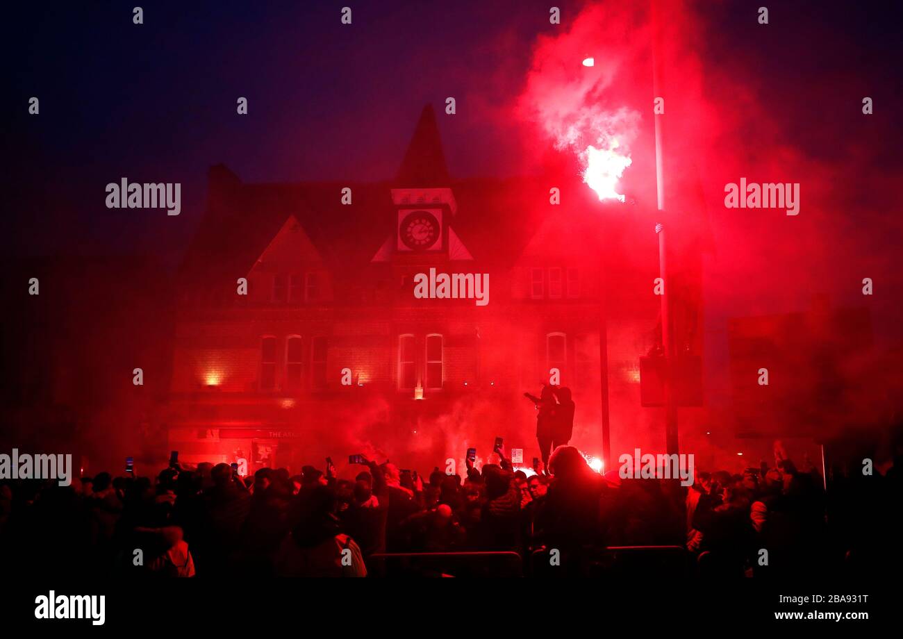 Fans let off flares ahead of the UEFA Champions League round of 16 second leg match at Anfield, Liverpool. Stock Photo