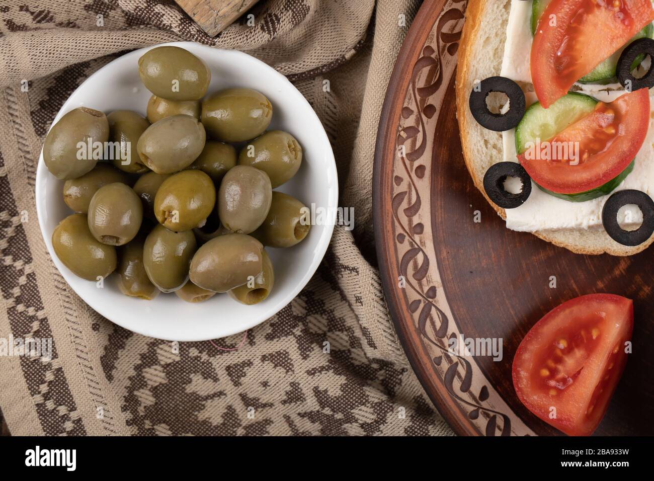 Marinated green olives with sandwiches around Stock Photo Alamy