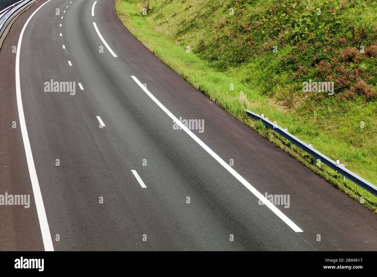 asphalt road through the green field Stock Photo - Alamy