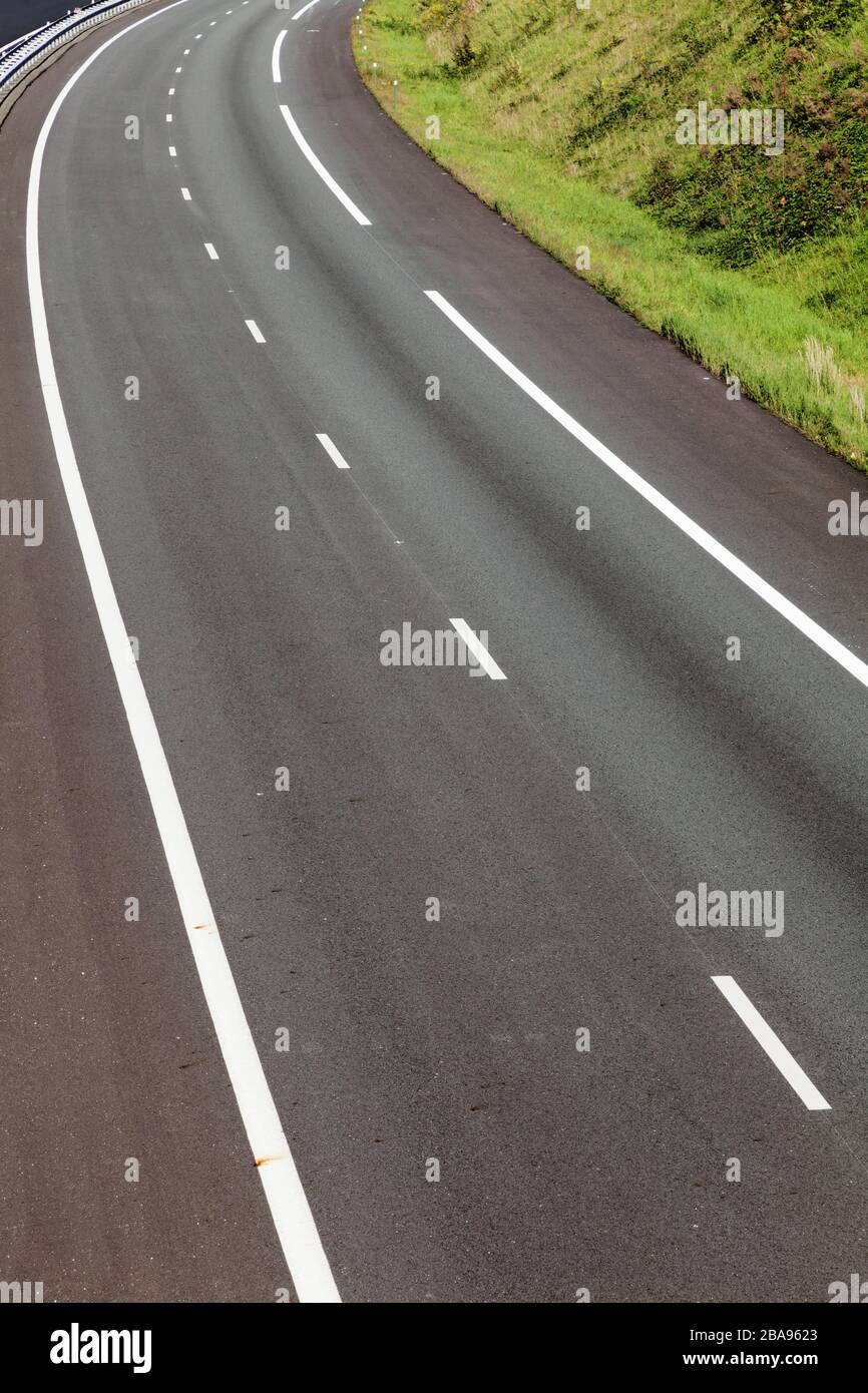 asphalt road through the green field Stock Photo - Alamy