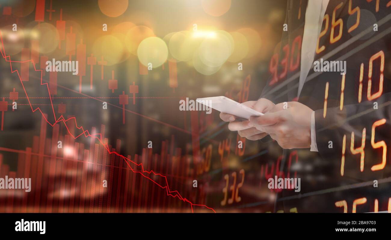 Businessman using tablet analyzing data. He paranoid world of economy finance stock graph and marketing.Depress from Circuit breaker, Problem economy Stock Photo