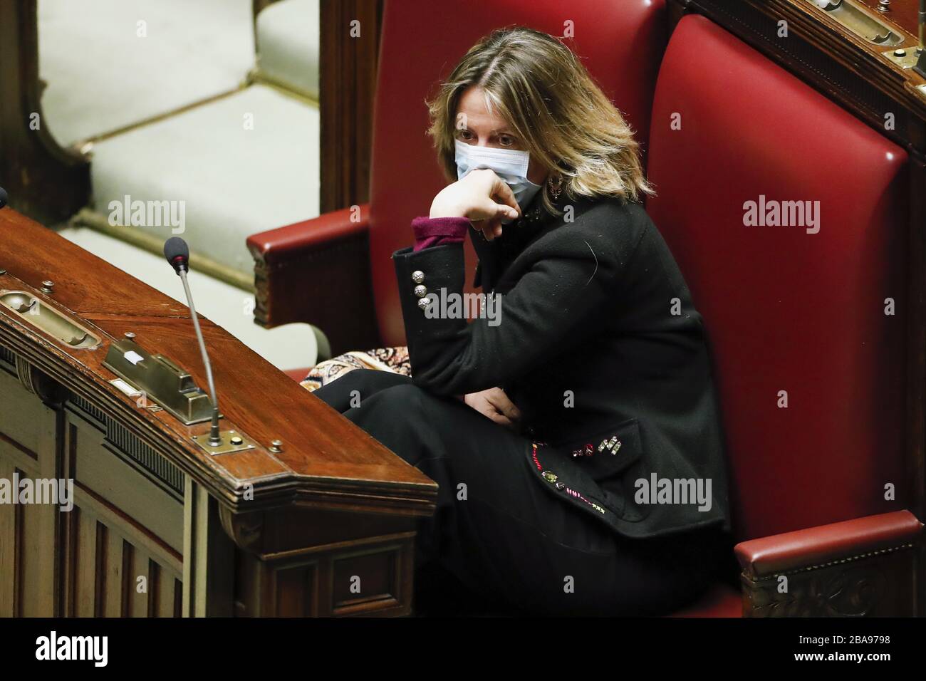 Italy, Rome, march 25, 2020 : Beatrice Lorenzin, former minister (Democratic Party), wearing a protective mask and gloves, listens to the President of Stock Photo