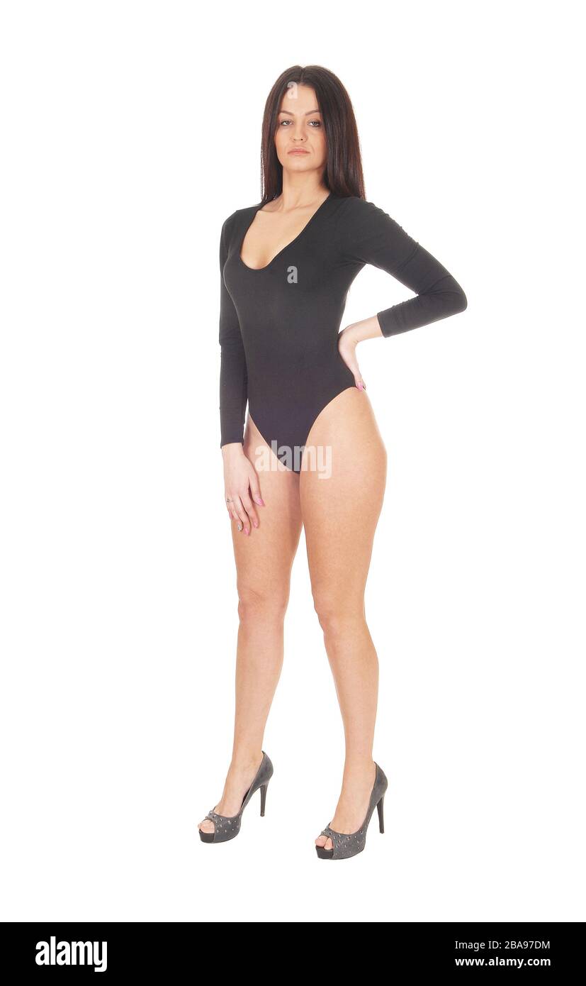 A young beautiful woman standing in a black body suit with long hair, showing her nice figure, isolated for white background Stock Photo