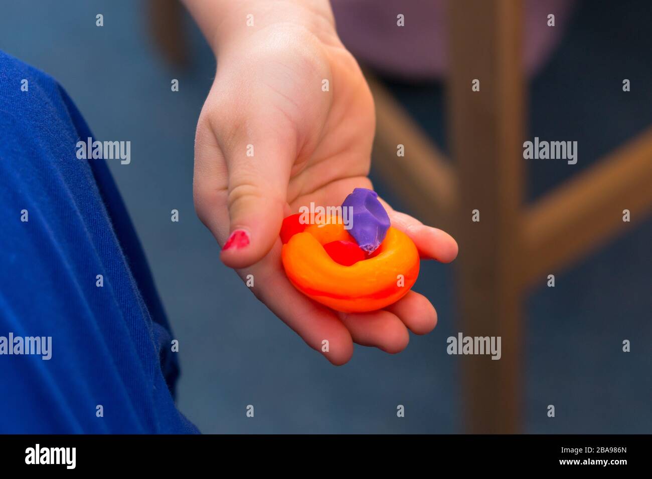 child playing with plasticine and making molds Stock Photo Alamy