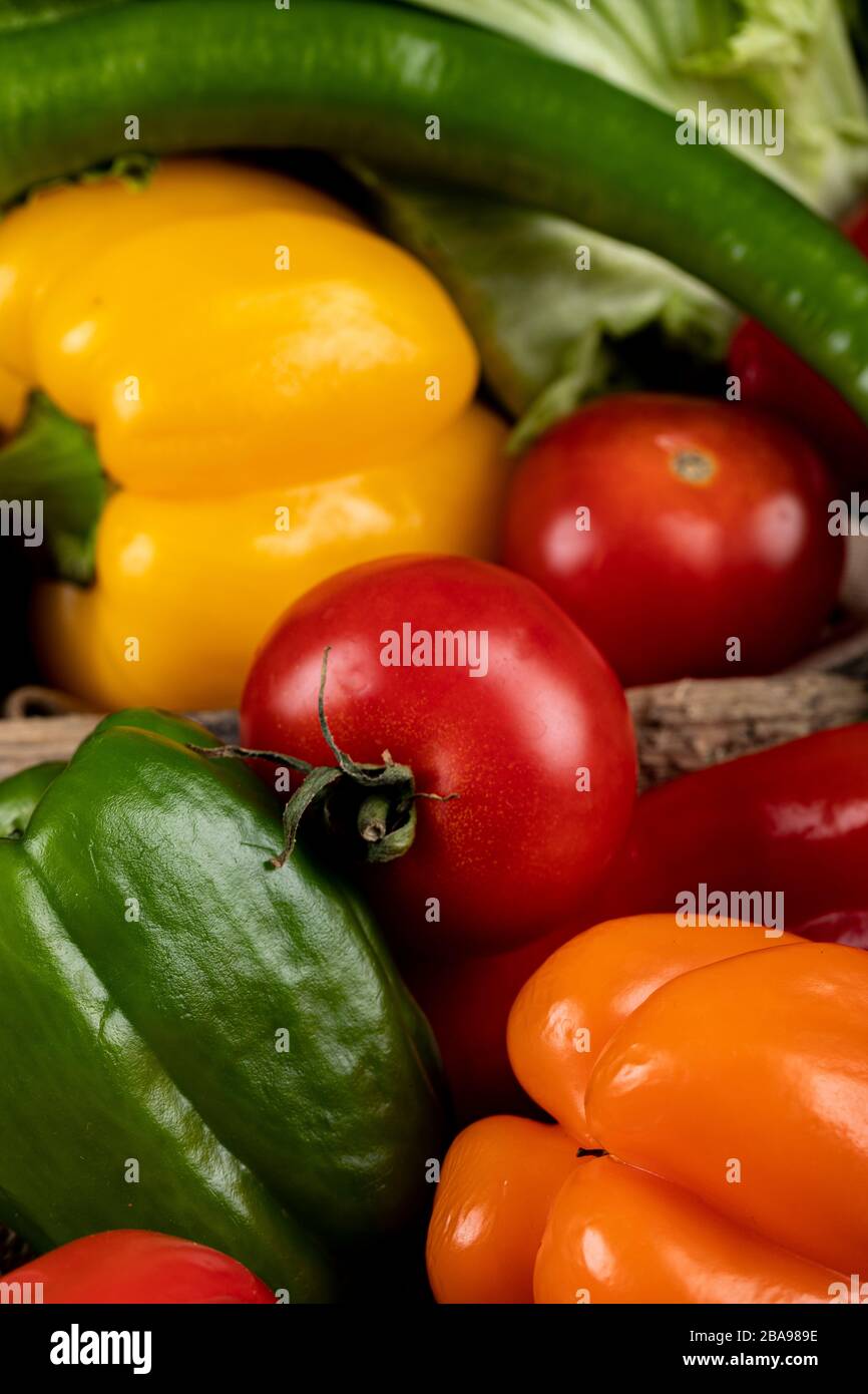 Colorful peppers and tomatoes in a tray Stock Photo - Alamy