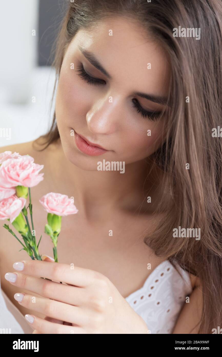 Young well-groomed girl with long brown hair and clean skin. Natural ...