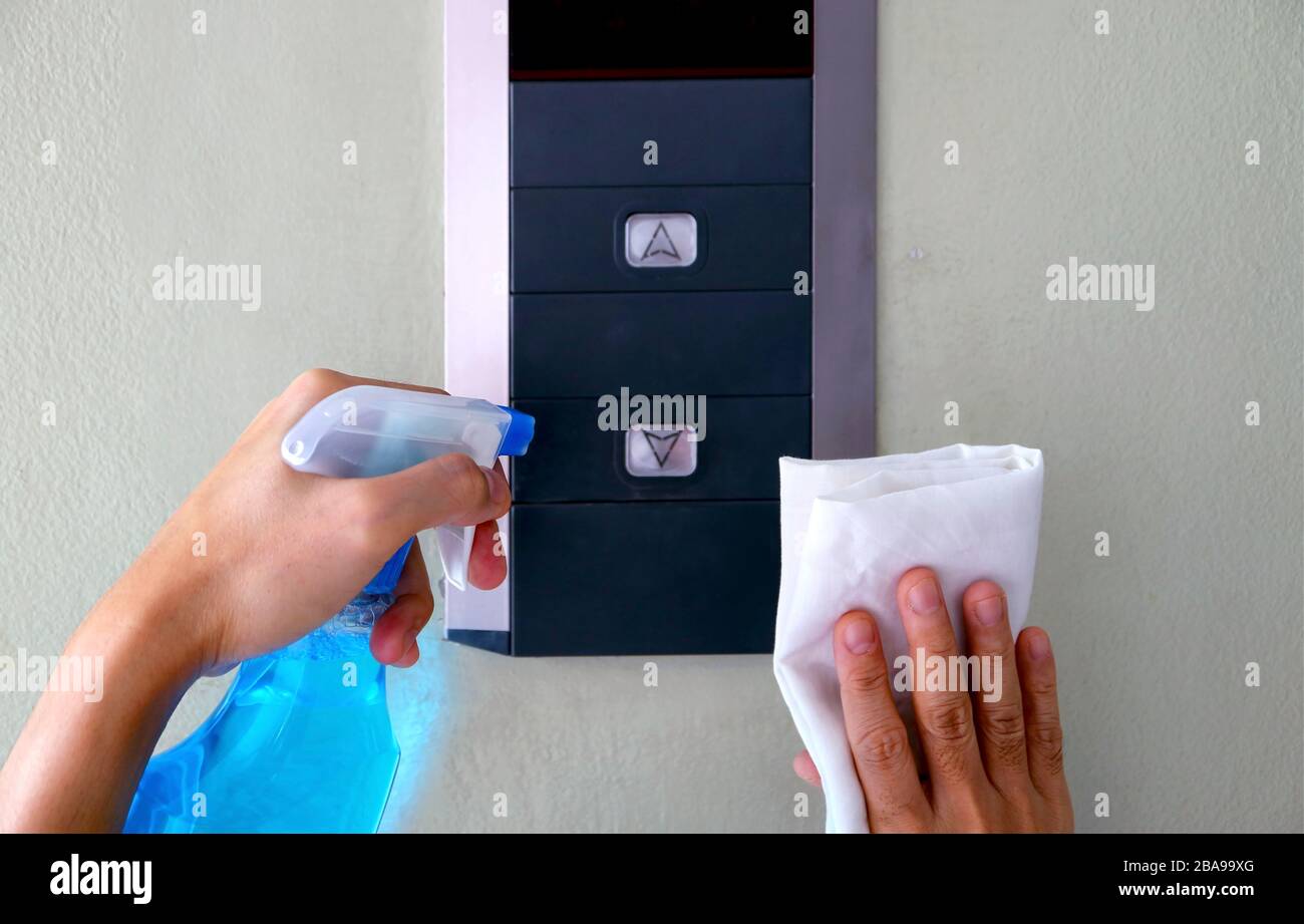 Closeup man's hands cleaning the elevator panel Stock Photo Alamy