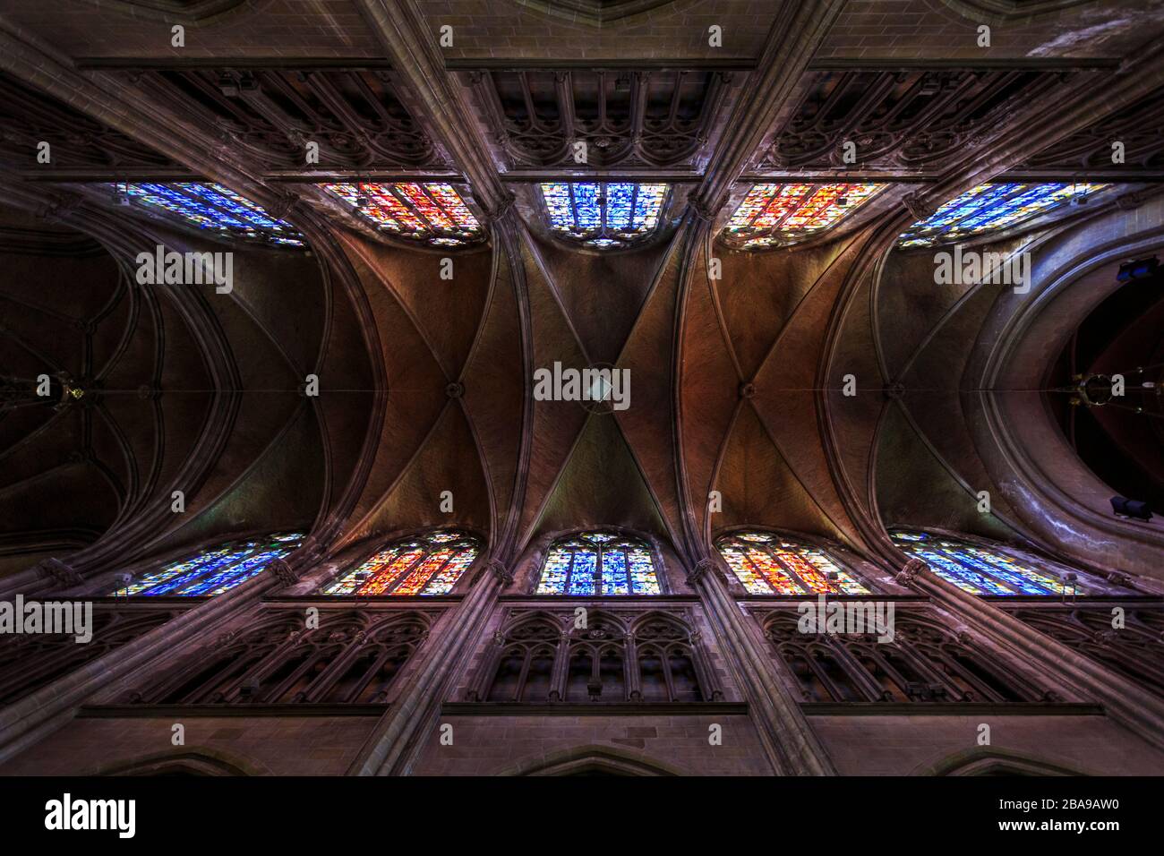 Wide picture from the ceiling of the Church of Saint Peter and Saint Paul, with colored stained glass. Stock Photo