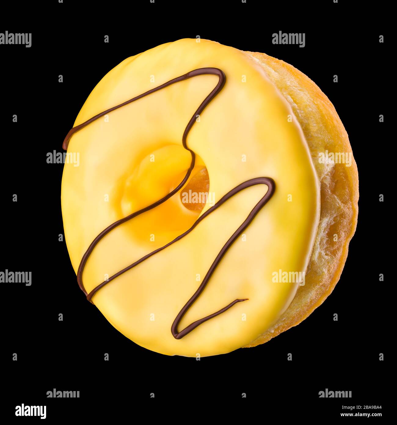 Glazed donut with sprinkles on a black background Stock Photo - Alamy