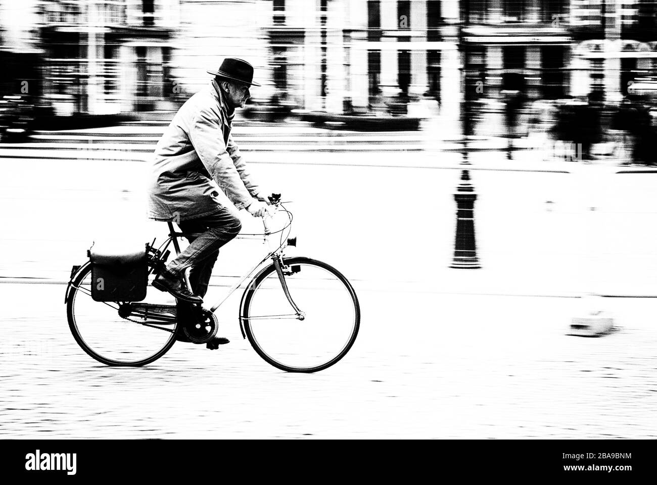 Elderly Gentleman on Bicycle in Monochrome Stock Photo