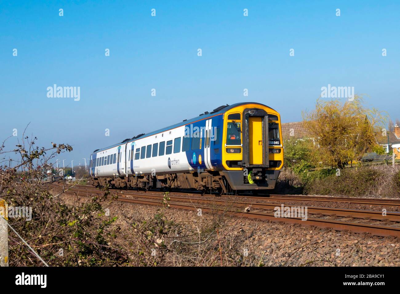 Northern Rail train 158845 approaching Marske on its way to Saltburn.  This is a refurbished Class 158 train replacing the previous Pacers. Stock Photo