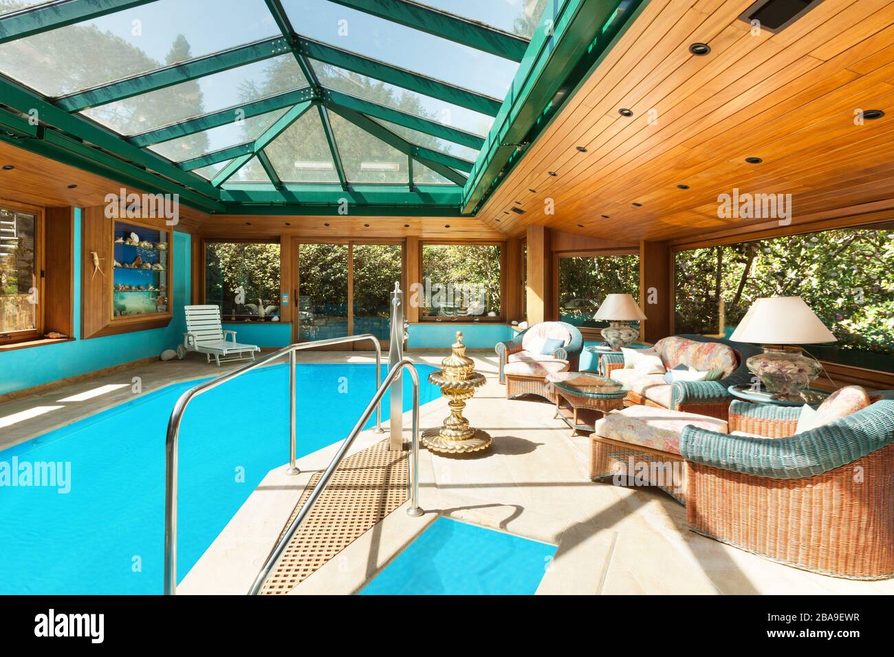 Interior of a residential house, large indoor pool, ceiling with