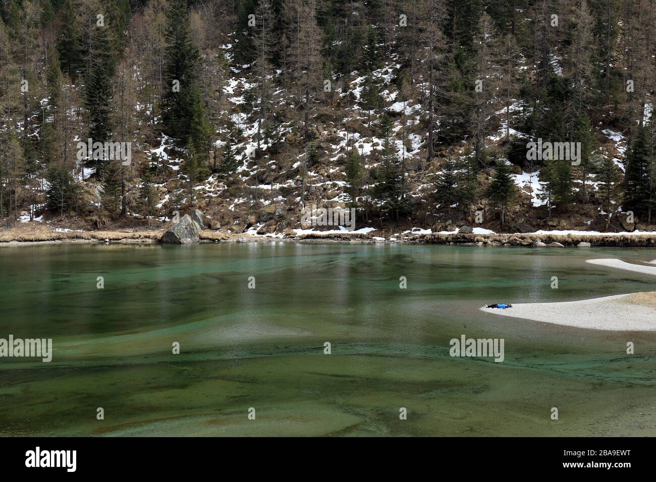 Lago delle Fate, Macugnaga, Italy, with lake and woods in winter Stock Photo