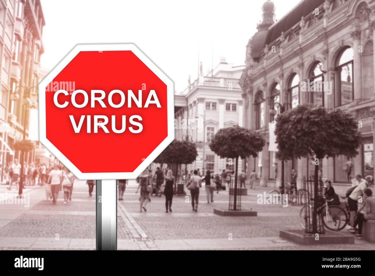 Corona virus warning sign in the in city Stock Photo