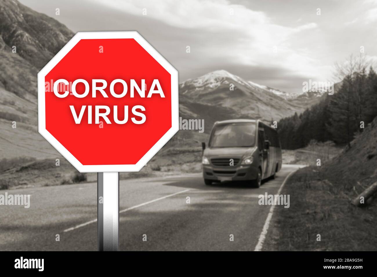 Corona virus warning sign on the mountain road Stock Photo