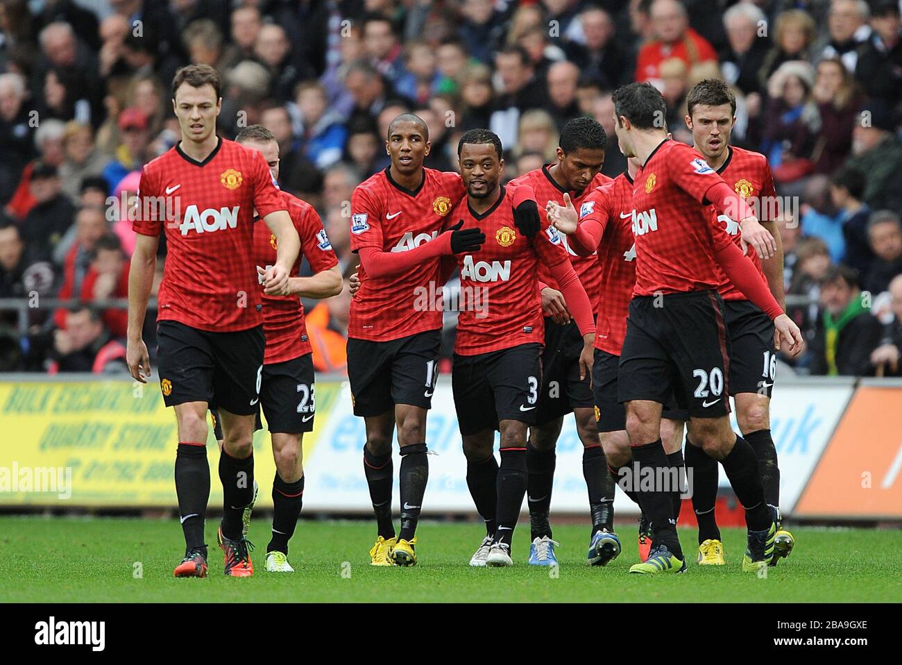 Manchester United's Patrice Evra (centre) celebrates scoring his teams first goal of the game with teammates Stock Photo