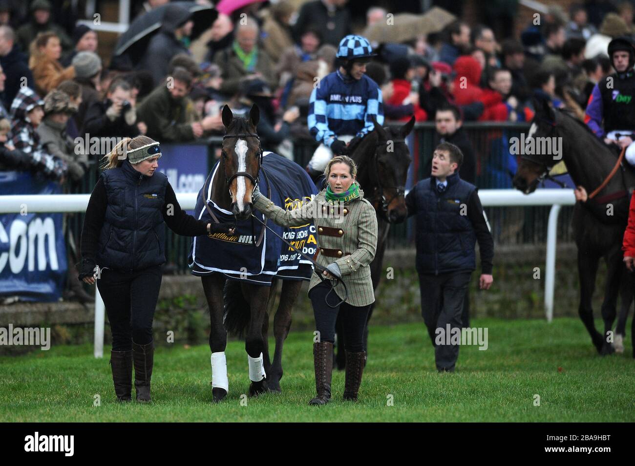 Event Rider Laura Collett (right) leads Kauto Star at the head of a pre ...