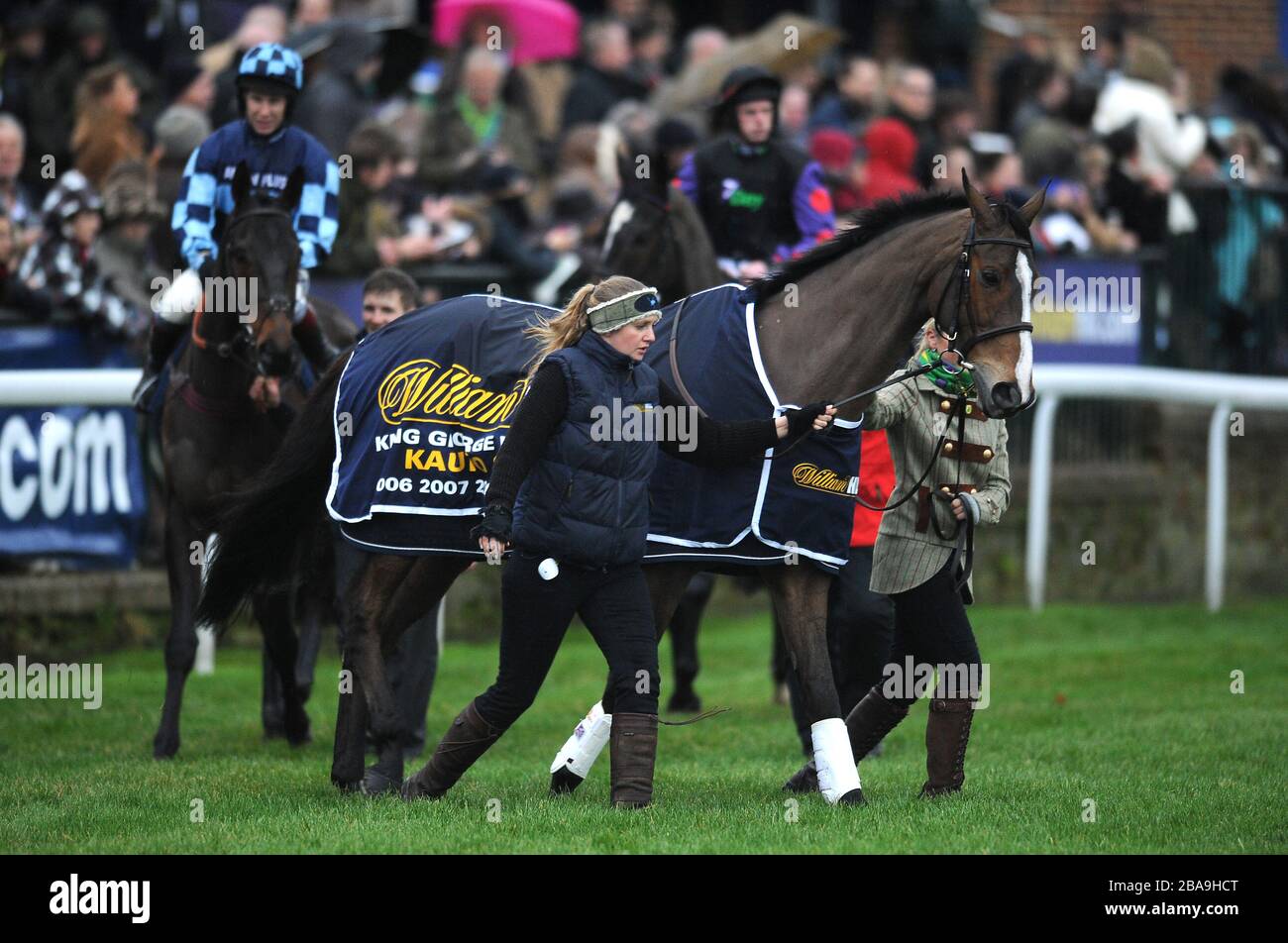 Event Rider Laura Collett (right) leads Kauto Star at the head of a pre ...
