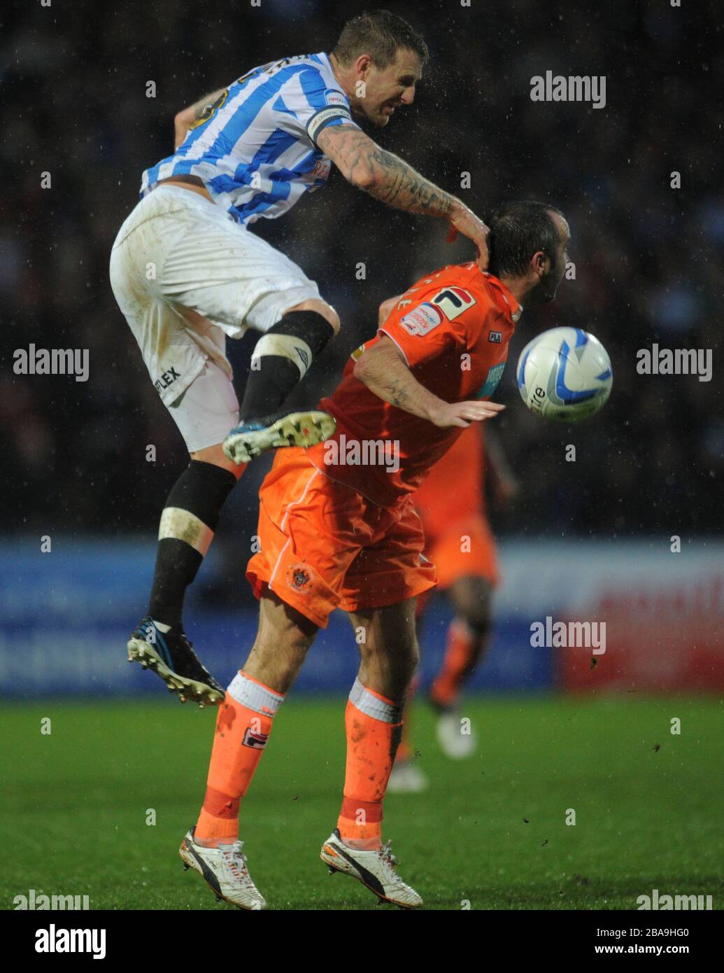 Huddersfield Town's Peter Clarke and Blackpool's Gary Taylor-Fletcher (right) Stock Photo