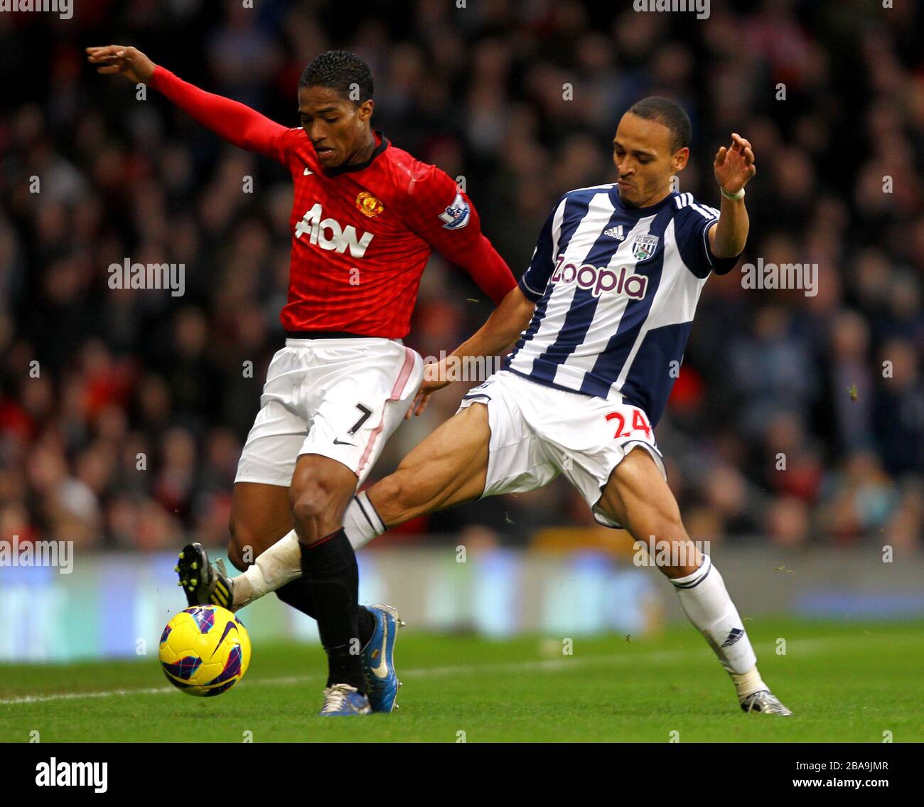 Manchester United's Antonio Valencia (left) and West Bromwich Albion's Peter Odemwingie in action Stock Photo