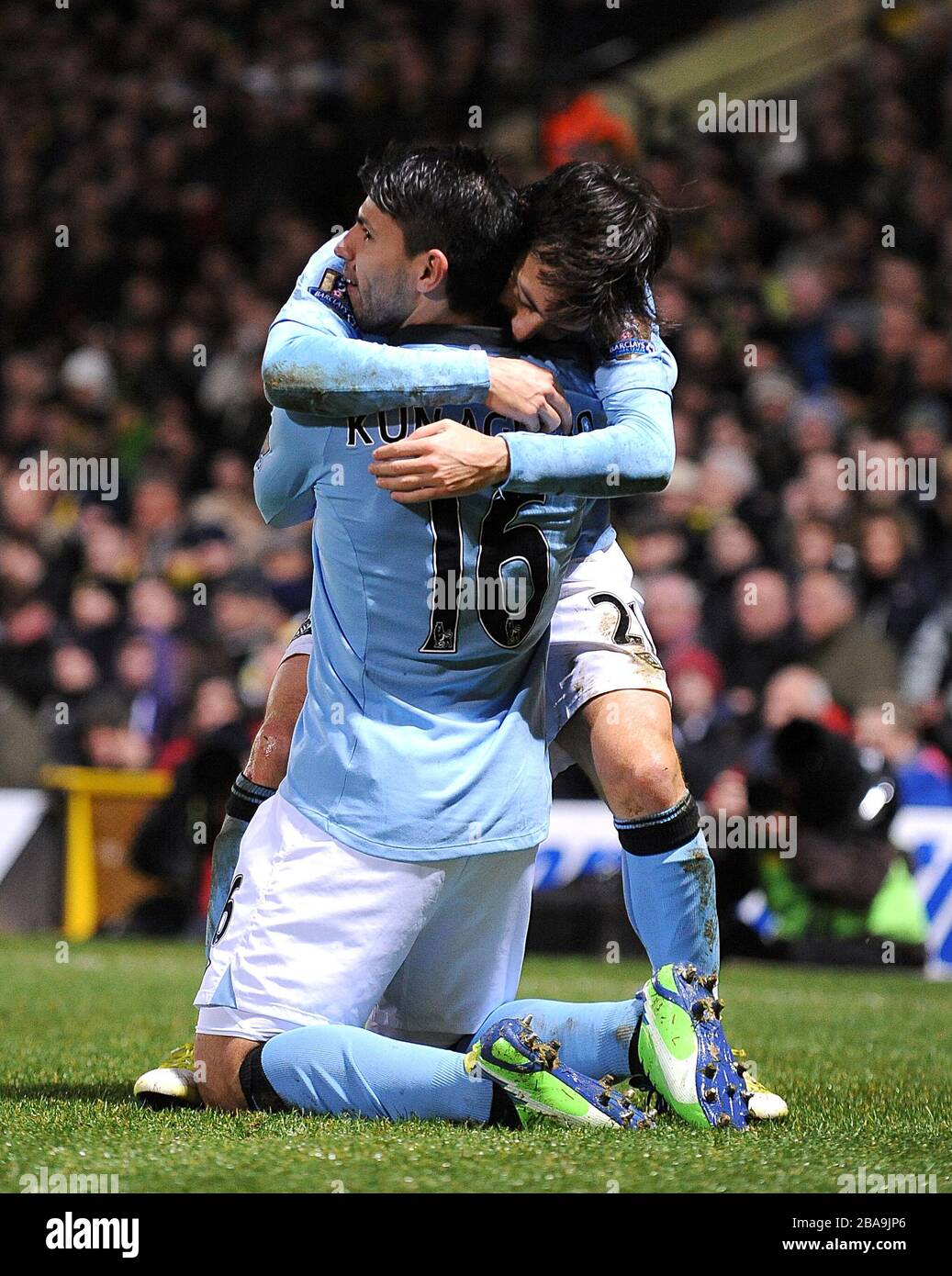 Manchester City's Sergio Aguero (left) celebrates with his team-mate David Silva (right) after scoring his team's third goal Stock Photo