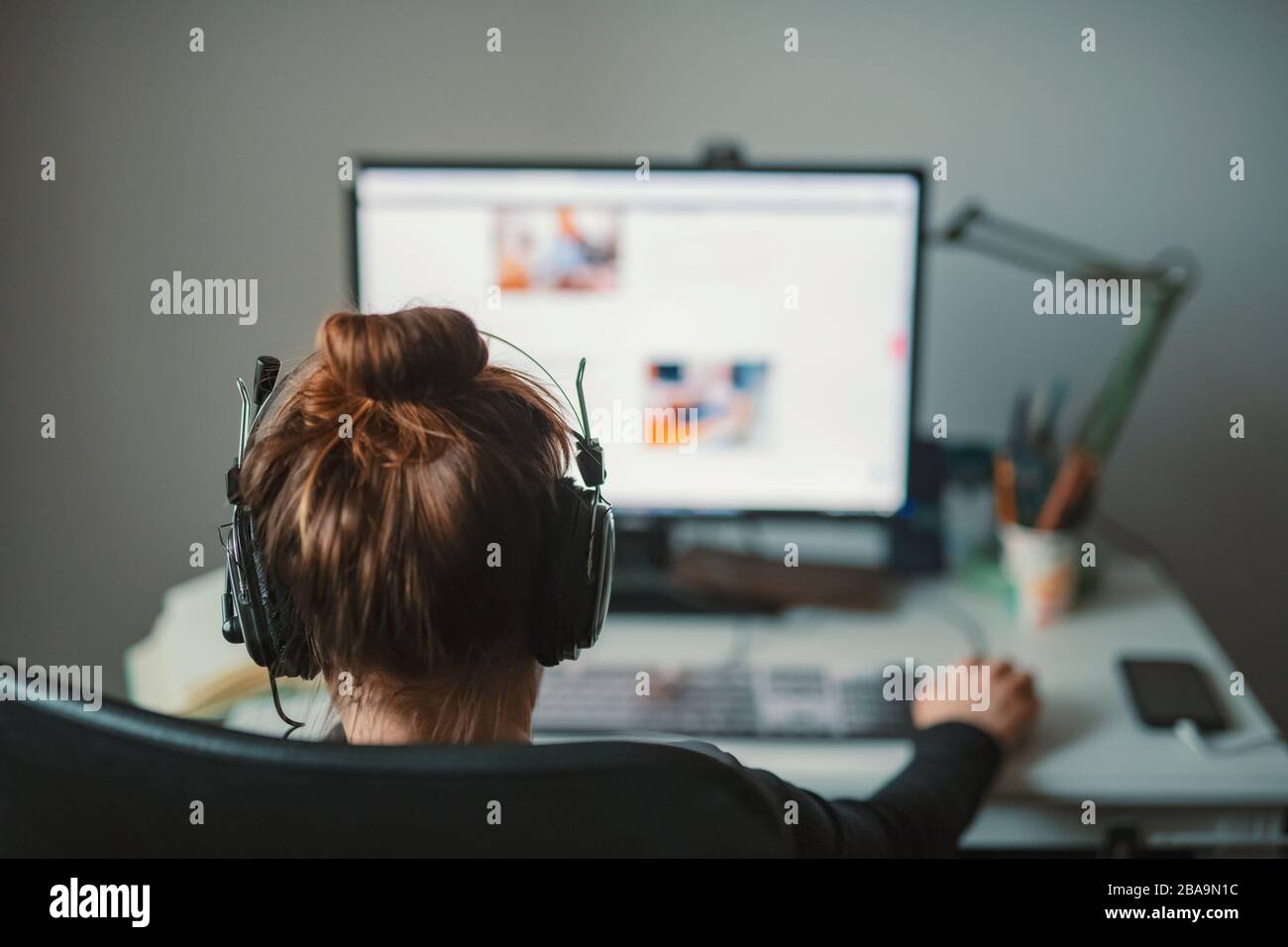 girl working from her home Stock Photo