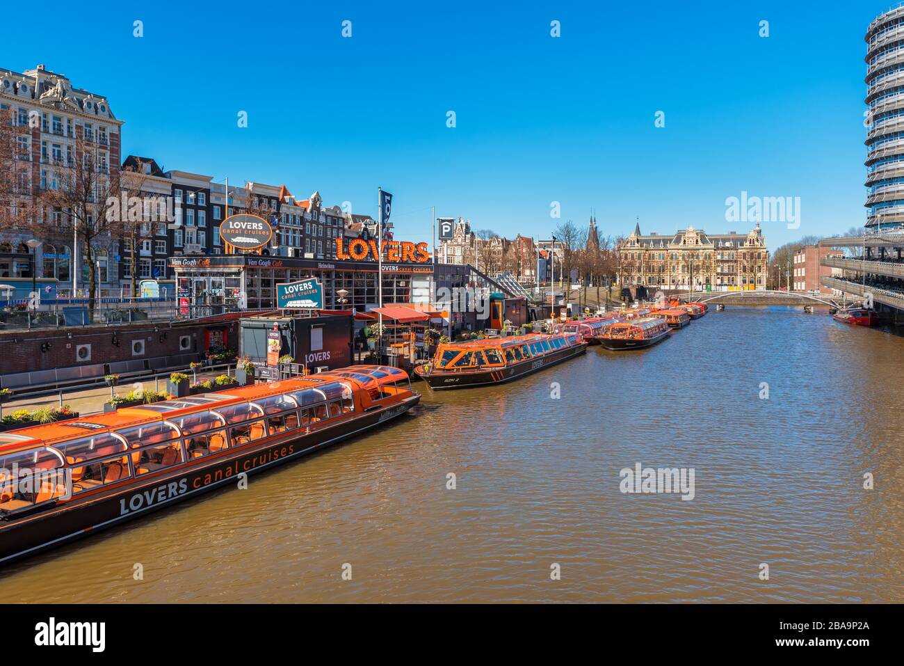 Group of empty tour boats in Amsterdam Netherlands because of coronavirus outbreak Stock Photo