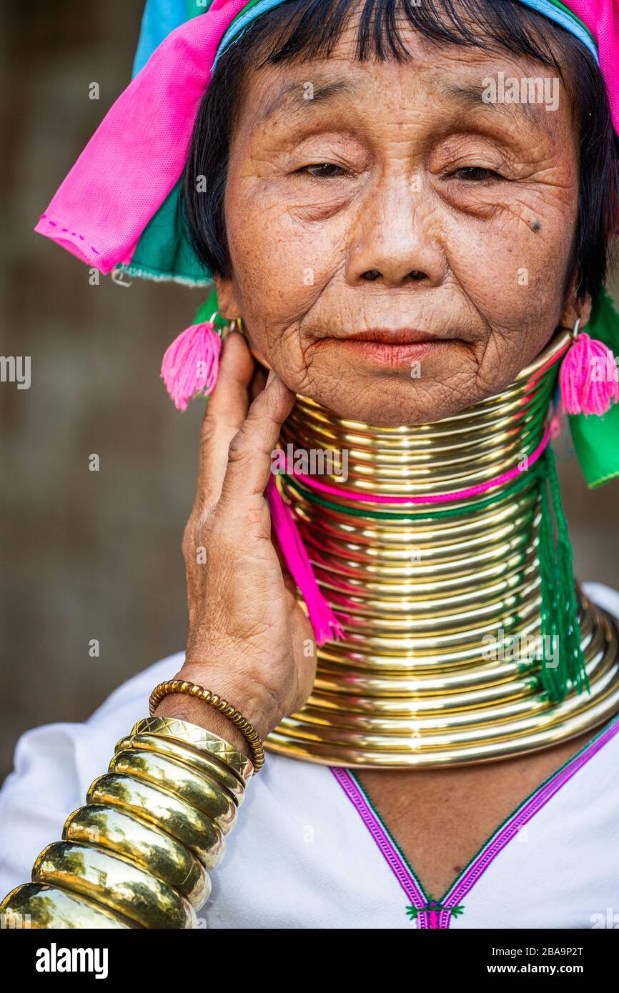 Portrait of an old Padaung woman in traditional dress and with metal rings around her neck. February 12, 2019, Myanmar. Stock Photo