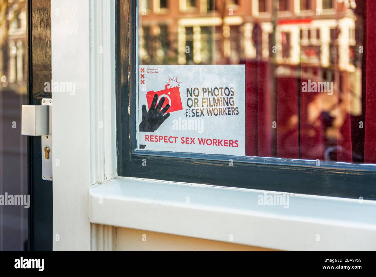 Respect Sex Workers Sign in Red Light District of Amsterdam, Netherlands. People are requested not to film or take photos. Stock Photo