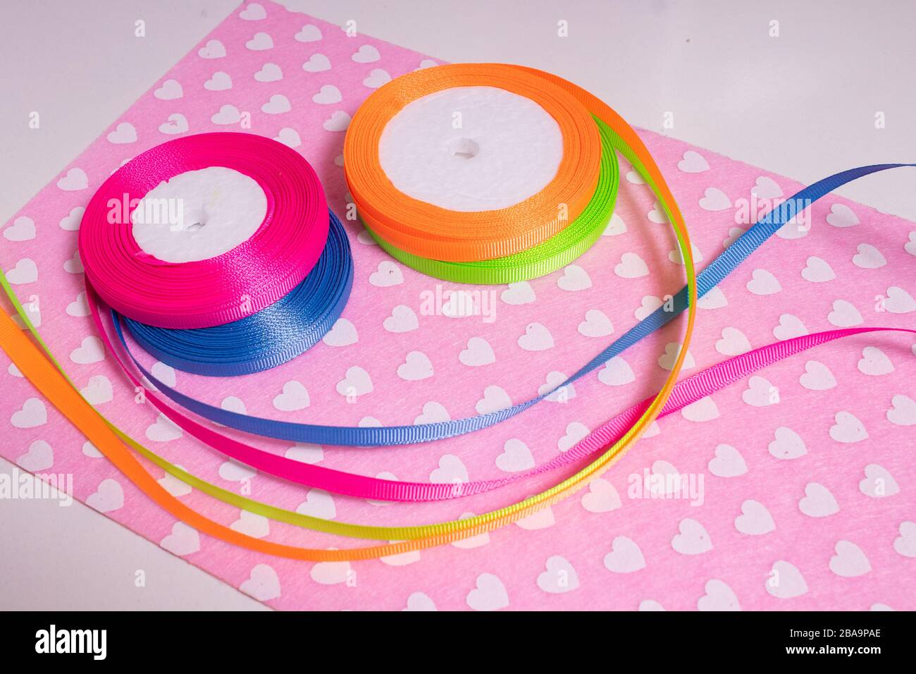 Multicolored ribbons for handmade products. Passion for the soul Stock Photo