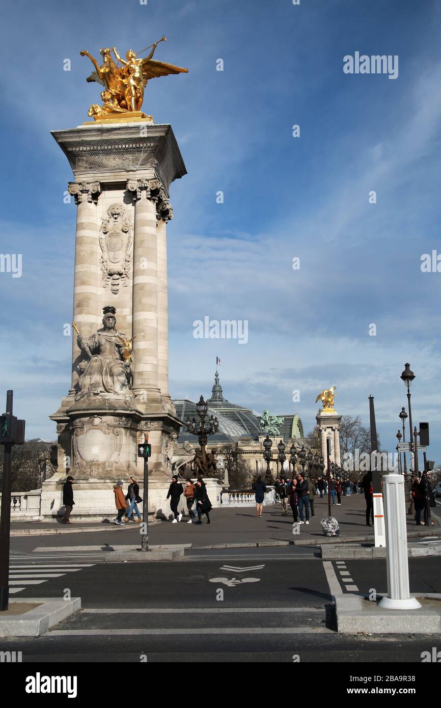 Column at the end of the Pont Alexandre III (Alexander III Bridge) on the River Seine, Paris, France Stock Photo