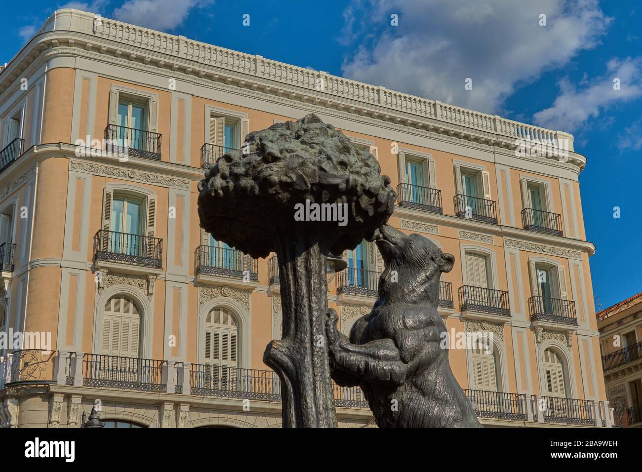Puerta del sol,Madrid,Spain;September 16 2018:Typical statue of the center of Madrid of the Bears and the Madroño made of metal and background an old Stock Photo