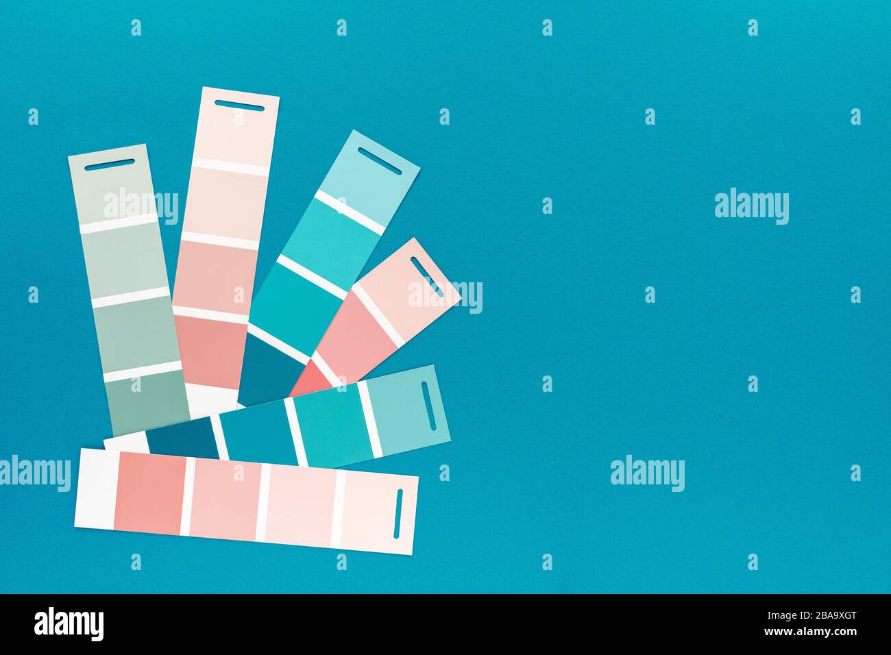 Selection of palette for painting, sample color catalog on a turquoise