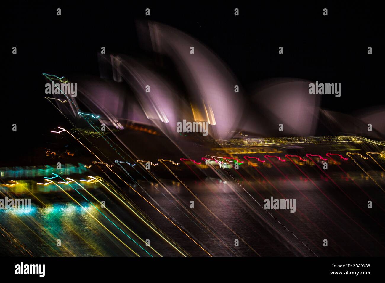 Light trails bleed across the famous image of the Sydney Opera House, NSW, Australia Stock Photo