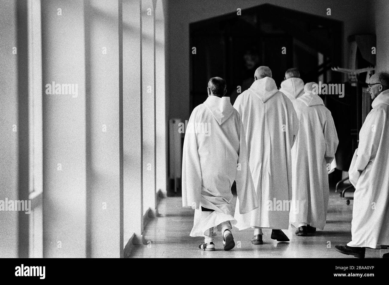 Monks make their way to the prayer chapel at Sancta Maria Abbey at Nunraw, East Lothian, home since 1946 to the Order of Cistercians of the Strict Observance. Around 15 monks were resident at Nunraw in 1996, undertaking a mixture of daily tasks and strict religious observance. The present purpose-built building dates from 1969 when the monks moved from the nearby Nunraw house. Stock Photo