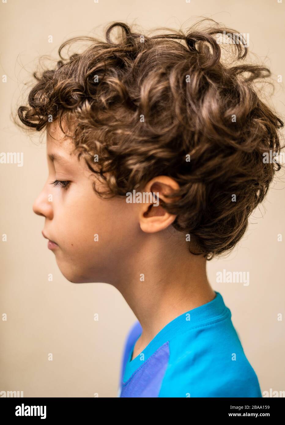 Cute school age kid side view portrait on a natural light Stock Photo