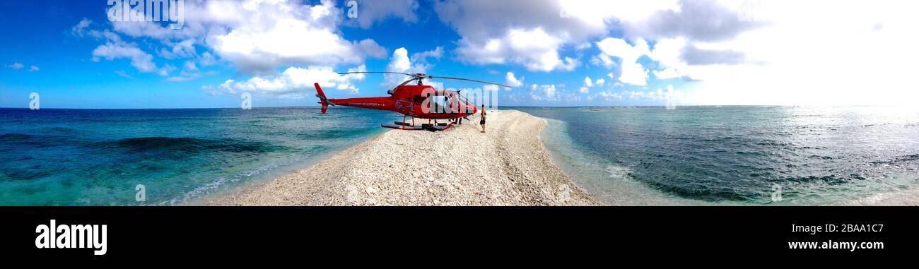 A helicopter landed on a disappearing beach in the Great Barrier Reef, Queensland, Australia Stock Photo