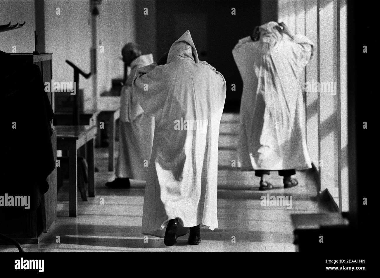 Monks make their way to the prayer chapel at Sancta Maria Abbey at Nunraw, East Lothian, home since 1946 to the Order of Cistercians of the Strict Observance. Around 15 monks were resident at Nunraw in 1996, undertaking a mixture of daily tasks and strict religious observance. The present purpose-built building dates from 1969 when the monks moved from the nearby Nunraw house. Stock Photo