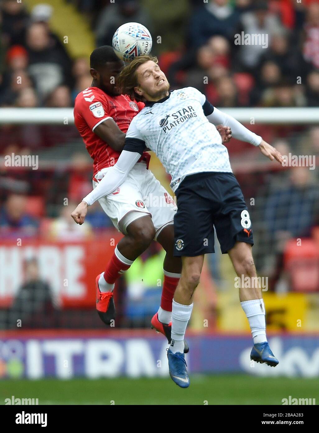 Luton Town's Luke Berry and Charlton Athletic's Deji Oshilaja battle
