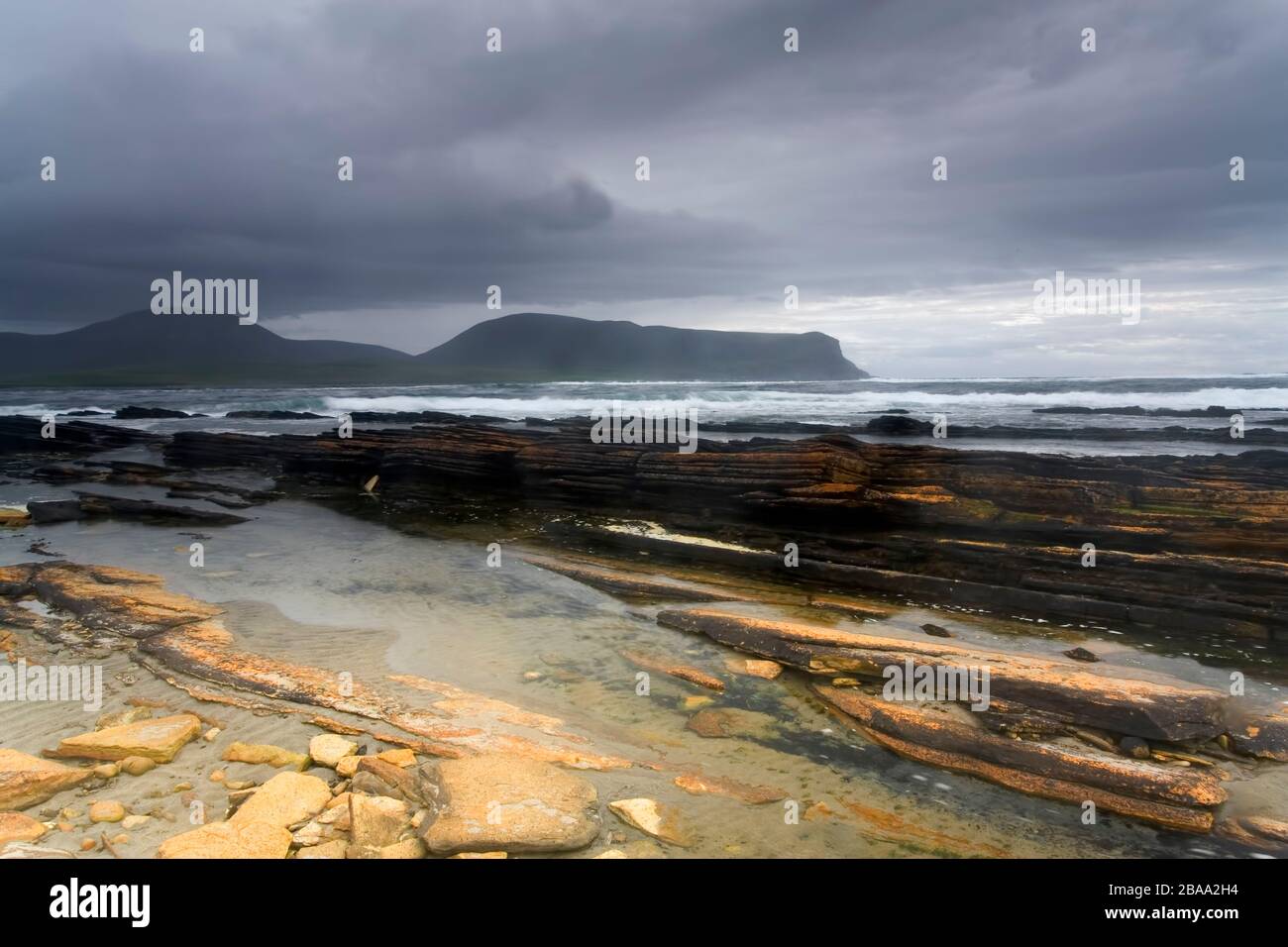 View of Beautiful Warbeth Bay in Orkney with a storm coming Stock Photo