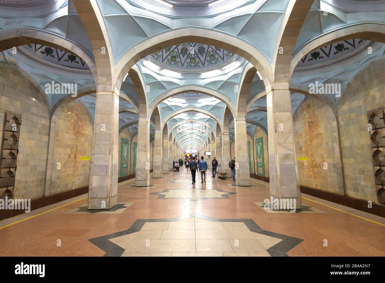 Alisher Navoi Metro station in Tashkent, Uzbekistan. In honor to the muslim poet of same name. Subway platform built with symmetrical domed ceiling. Stock Photo