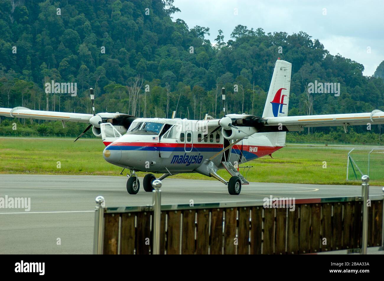 Malaysia Airlines turboprop de Havilland Twin Otter STOL short haul aircraft parked at Mulu airport, Sarawak, Malaysia. Stock Photo
