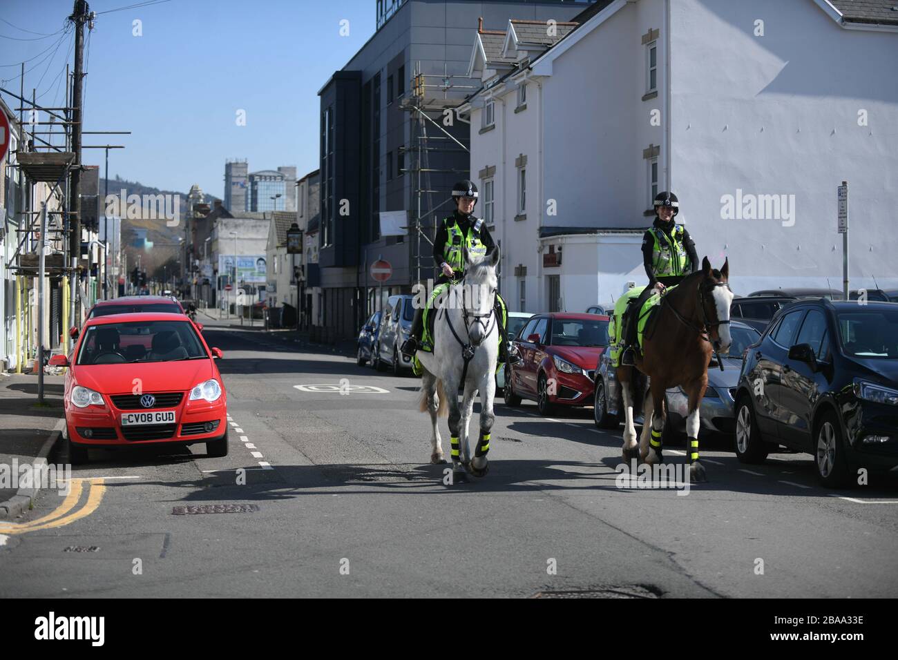 Swansea, Wales, UK.  26th March 2020. Police on horseback patrol the streets of Swansea as the UK heads towards a more stringent lockdown, with police given more power to detain and fine people who breach the government advice. Credit : Robert Melen/Alamy Live News Stock Photo